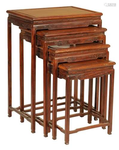 A SET OF FOUR 19TH CENTURY CHINESE HARDWOOD NEST OF TABLES