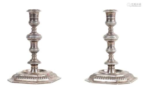 A PAIR OF ELIZABETH II CAST SILVER CANDLESTICKS