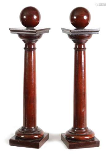 A PAIR OF REGENCY TURNED MAHOGANY COLUMNS