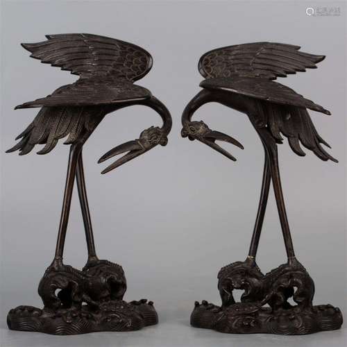 A pair of cast iron cranes, 20th century