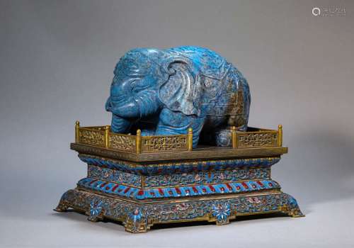 A CARVED LAPIS LAZULI ELEPHANT WITH CLOISONNE ENAMEL STAND.M...