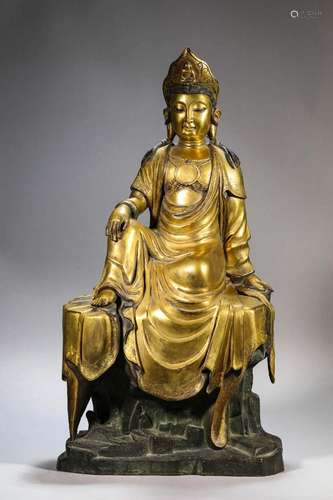 A GILT-BRONZE FIGURE OF SEATED GUANYIN