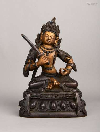 A GILT-BRONZE FIGURE OF MANJUSRI.MARK OF QIANLONG