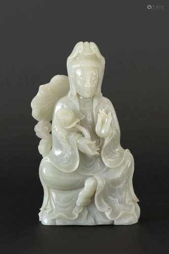 A CARVED WHITE JADE GUANYIN