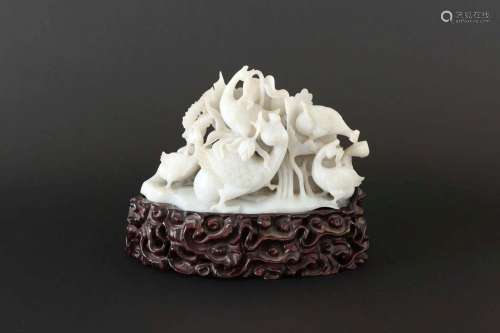 A CARVED WHITE JADE GOOSE GROUP