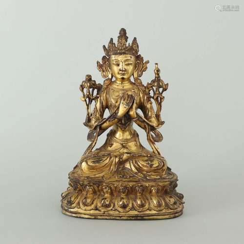 A GILT-BRONZE FIGURE OF MANJUSHRI