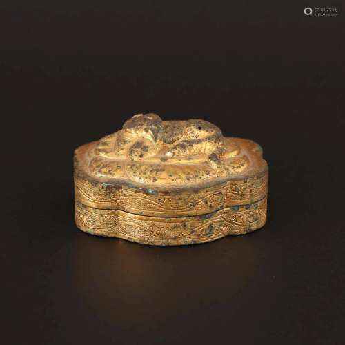 A CRAVED GILT-BRONZE BOX AND COVER