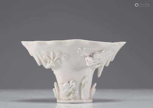 LIBATION CUP IN BLANC DE CHINE DECORATED WITH DRAGONS KANGXI...