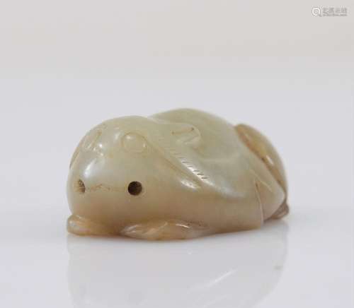 GREEN JADE CARVED WITH A RABBIT, MING PERIOD OR EARLIER