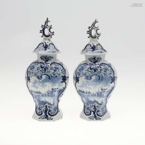 PAIR OF ANTIQUE DELFT LIDDED VASES.