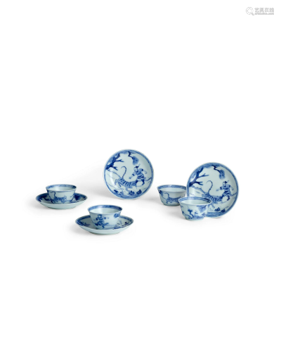FOUR BLUE AND WHITE 'WUSONG AND TIGER' TEA BOWLS AND SAUCERS...