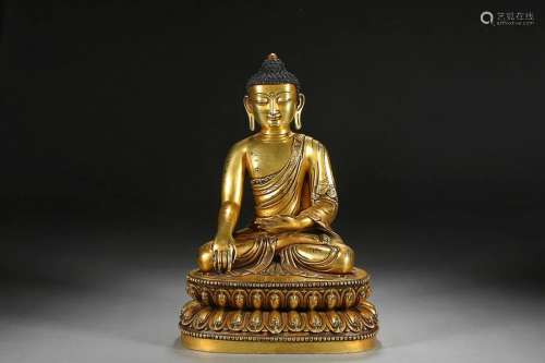 CHINESE GILT-BRONZE FIGURE OF SAKYAMUNI, 'MING YONGLE' MARK