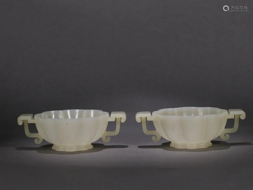 TWO CHINESE HETIAN JADE HANDLED CUPS WITH CARVED 'FLORAL'