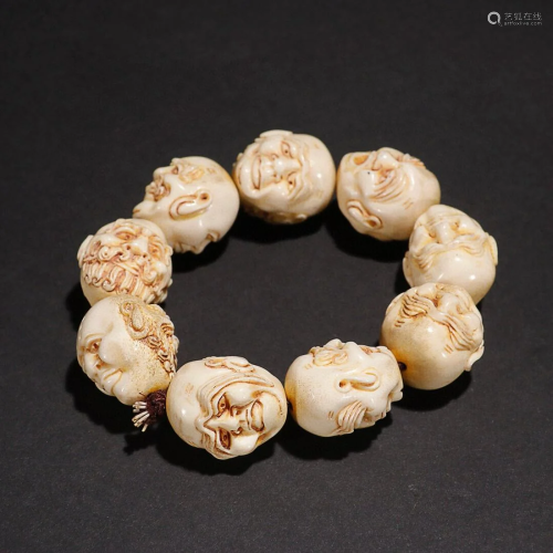 CHINESE RARE MATERIAL BEADED BRACELET WITH CARVED 'ARHAT'