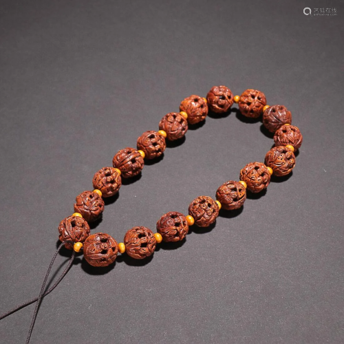 CHINESE WALNUT ROSARY WITH CARVED 'FIGURE STORY'