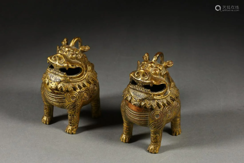 TWO CHINESE GILT-LACQUERED BRONZE AUSPICIOUS BEAST-FORM INCE...