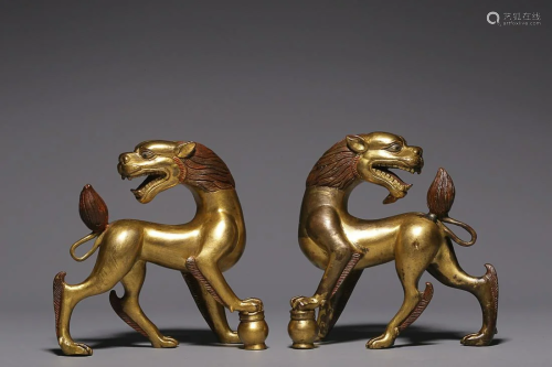TWO CHINESE GILT-BRONZE FIGURE OF LIONS