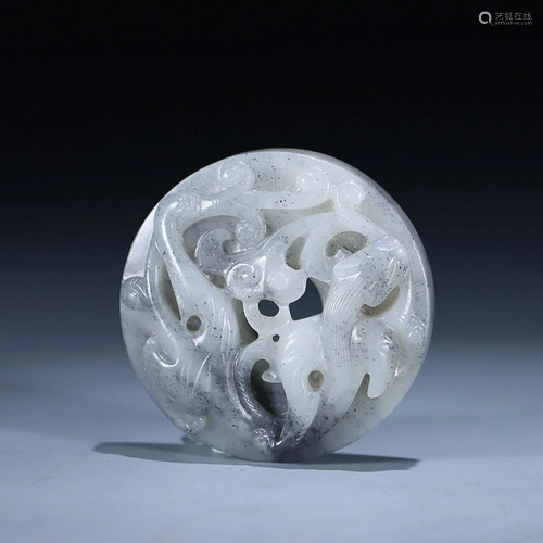 CHINESE HETIAN BLACK-AND-WHITE JADE BI DISC WITH CARVED 'DRA...