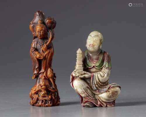 A SOAPSTONE LUOHAN AND A CARVED BONE GUANYIN