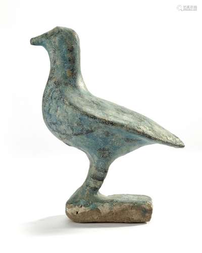 AN ISLAMIC TURQUOISE GLAZED FIGURE OF A BIRD