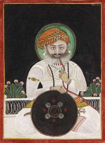 A PORTRAIT OF A RAJA SMOKING A HUQQA MEWAR, NORTH INDIA, MID...