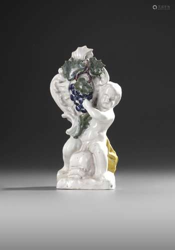 A  SCHREZHEIM FAIENCE STATUETTE 'ALLEGORY OF AUTUMN', 18TH C...