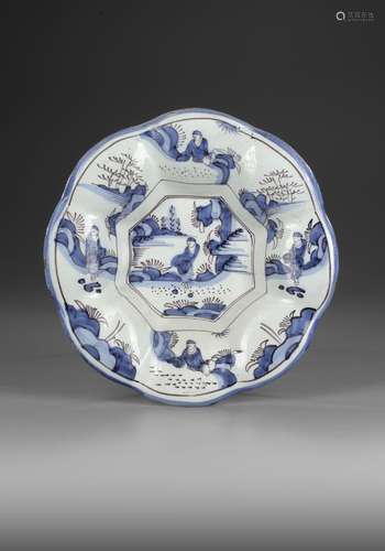 A LOBBED FAIENCE CHARGER, DELFT OR GERMANY, LATE 17TH CENTUR...