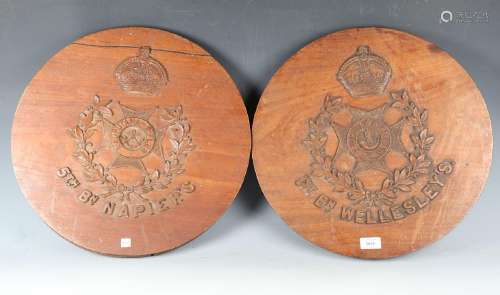 A pair of early to mid-20th century carved wood circular pla...