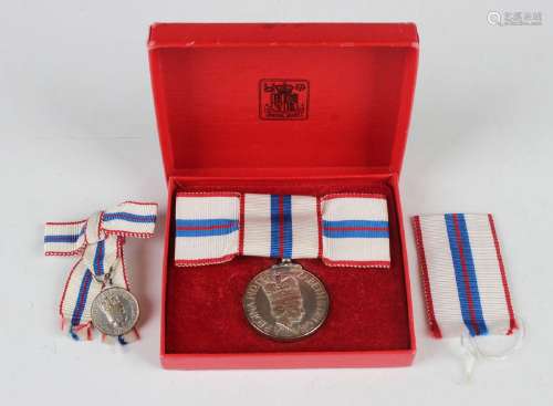 An Elizabeth II Silver Jubilee Medal 1977, lady's issue, wit...
