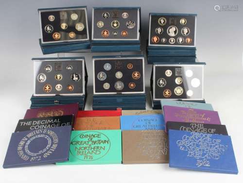 A large collection of Royal Mint year-type proof coin sets.