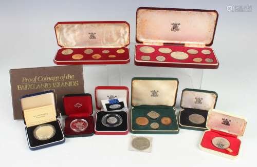 A collection of Royal Mint silver proof coins, including a B...