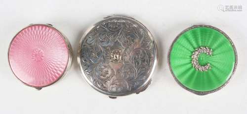 A George V silver and pink enamelled circular powder compact...