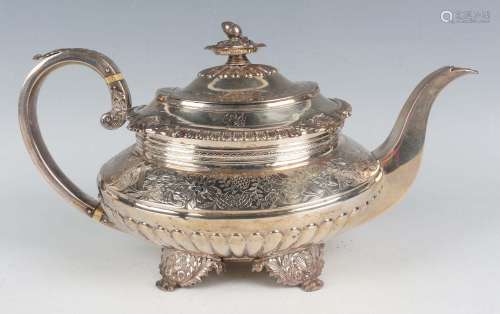 A George IV silver teapot of squat oval half reeded form, th...