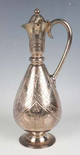 A Victorian Aesthetic silver ewer, the narrow tapering neck ...