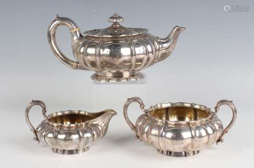 A William IV and later silver three-piece tea set of squat c...
