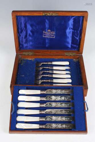 A set of six Edwardian silver and mother-of-pearl handled de...