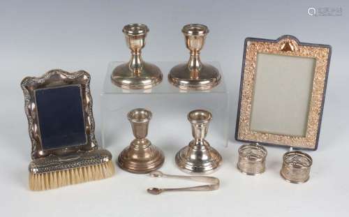 A group of silver items, including a pair of stub candlestic...
