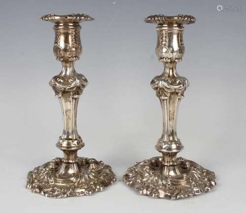 A pair of George IV silver candlesticks, each with detachabl...