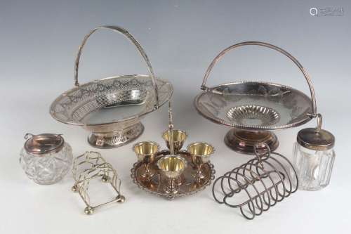 A group of plated items, including two swing handle cake bas...