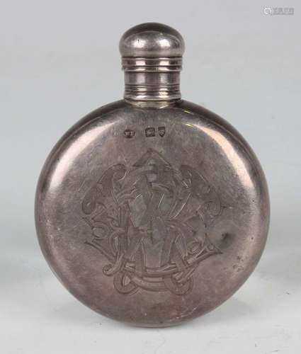 A Victorian silver curved circular hip flask with screw cove...