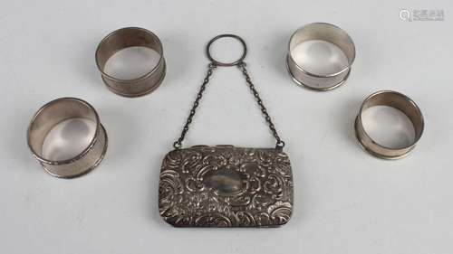 A George V silver purse, embossed with flowers and 'C' scrol...