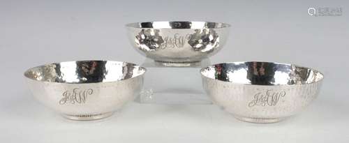 A set of three Edwardian silver circular bowls, each with ha...