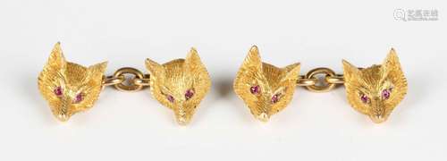 A pair of Alabaster & Wilson gold and ruby fox mask cuff...