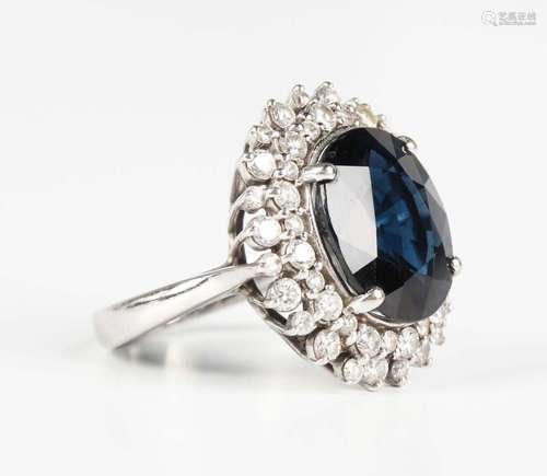 A white gold, natural blue spinel and diamond cluster ring, ...