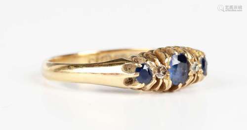 An 18ct gold, sapphire and diamond ring, mounted with three ...