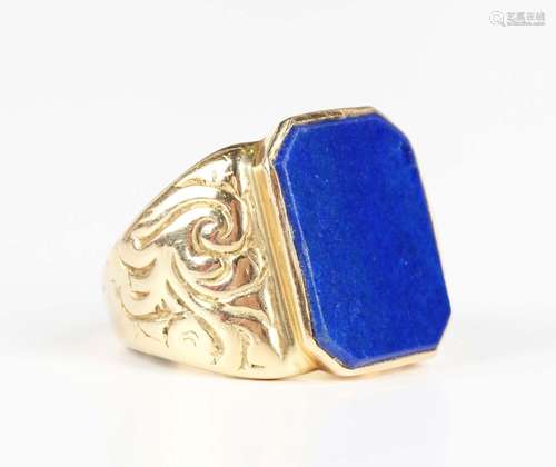 A gold and lapis lazuli rectangular signet ring with scroll ...