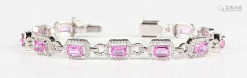 An 18ct white gold, pink sapphire and diamond cluster link b...