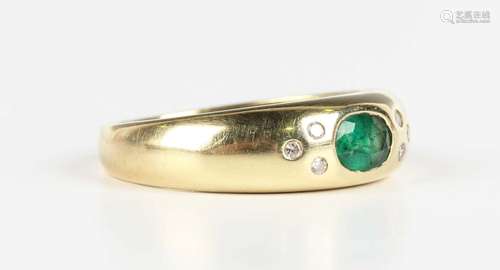 A gold, emerald and diamond ring, mounted with an oval cut e...