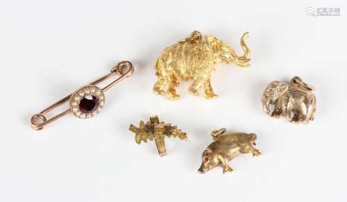 A 9ct gold elephant charm, width 2.7cm, another gold elephan...