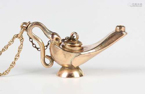 An Edwardian gold pendant in the form of an oil lamp, the ha...